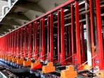 Rack transfer mechanism on a vertical lifting electroplating line