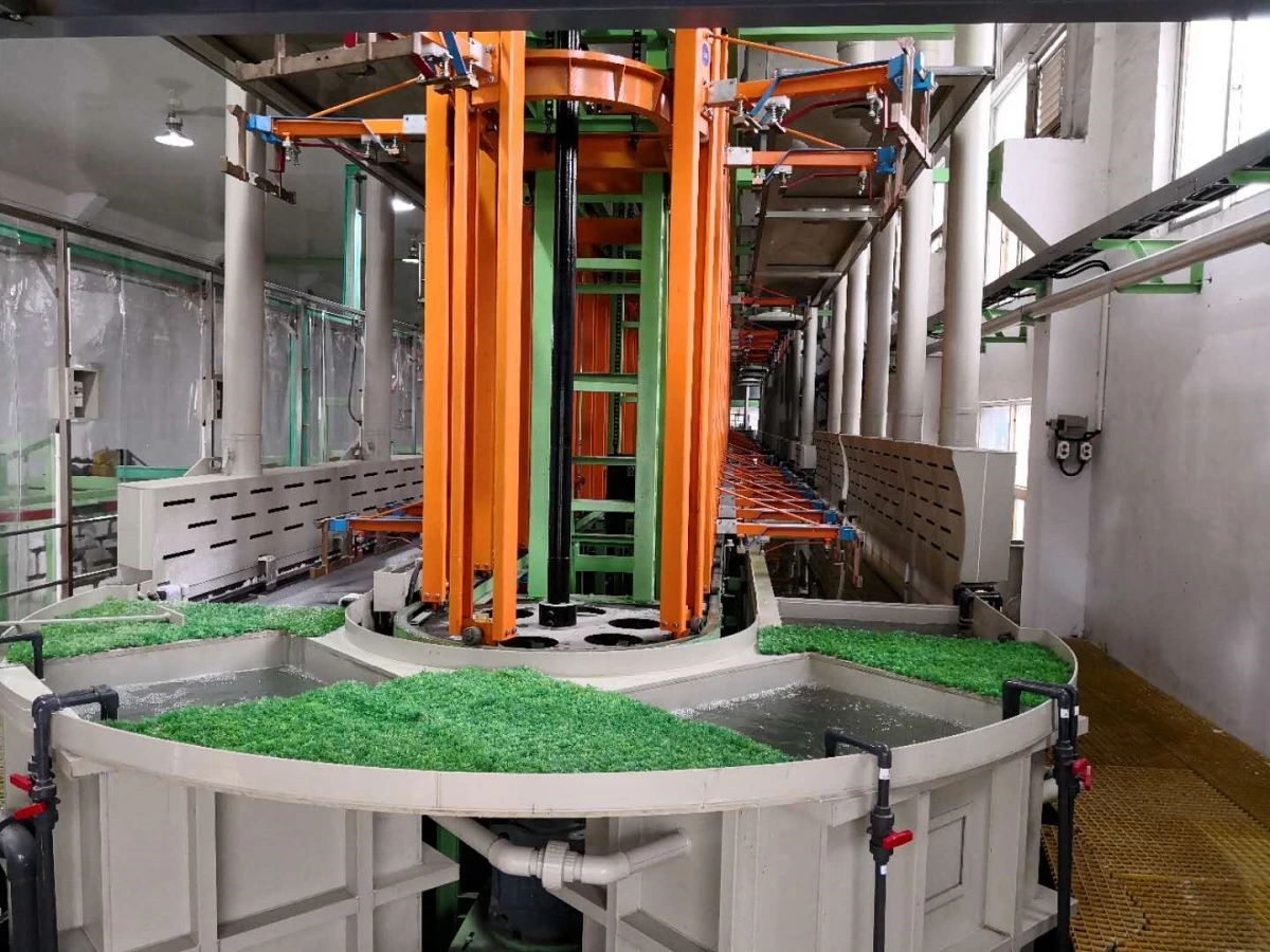Circular transfer station on a vertical lifting rack electroplating line