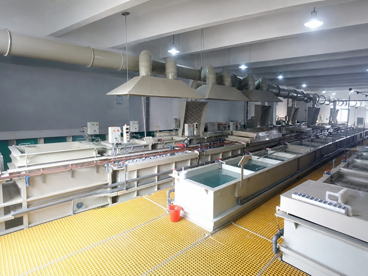 Tank exhaust hoods collecting fumes from an electroplating line