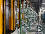 Loaded hardware racks in a linear electroplating line